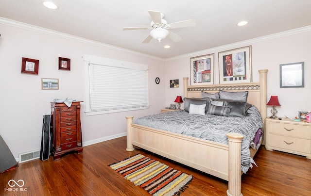 bedroom featuring dark wood-style floors, baseboards, visible vents, and ornamental molding