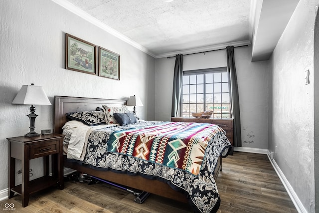 bedroom featuring ornamental molding, wood finished floors, and a textured wall