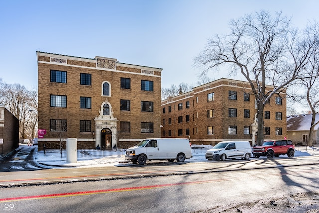 view of building exterior with fence