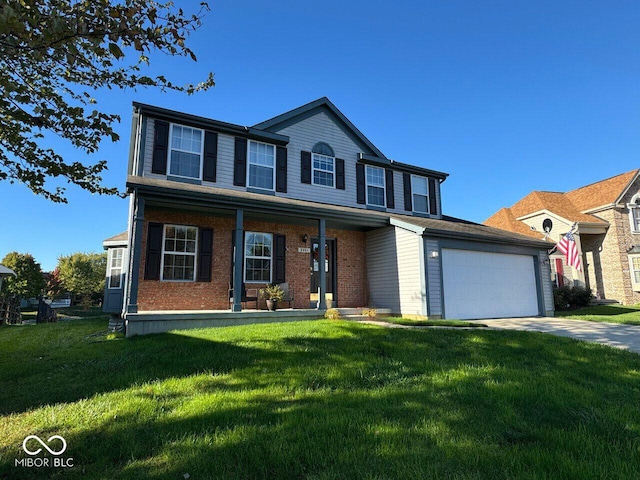 view of front of home featuring a porch, a garage, and a front lawn