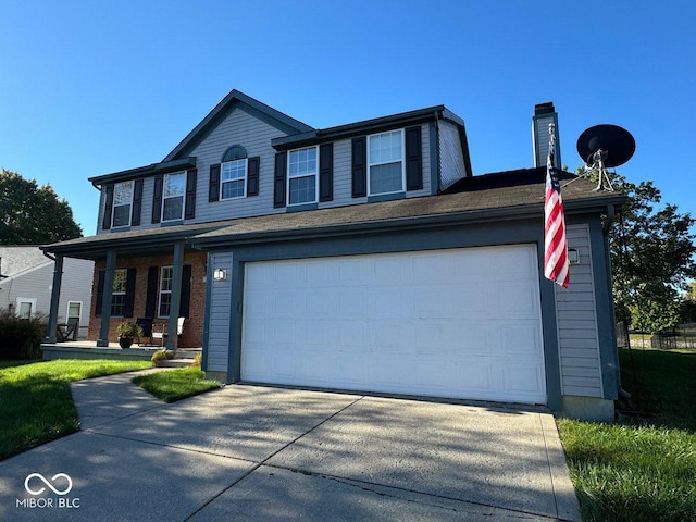 view of front of house featuring a garage and covered porch