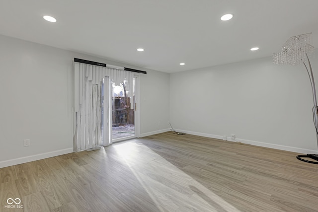 empty room with light hardwood / wood-style floors