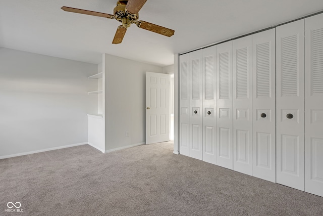 unfurnished bedroom featuring a closet, ceiling fan, and carpet