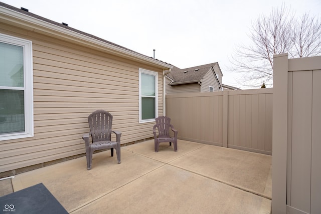 view of patio featuring fence