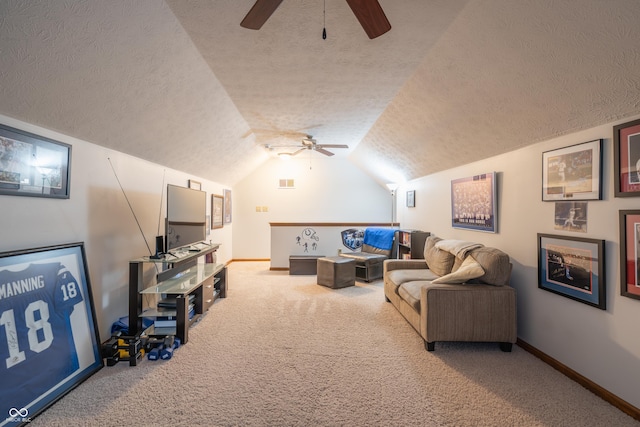 living area featuring carpet floors, vaulted ceiling, a textured ceiling, and baseboards