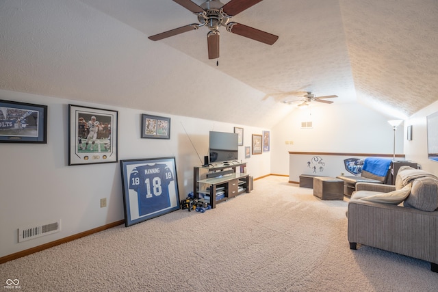 living room featuring baseboards, visible vents, carpet, vaulted ceiling, and a textured ceiling