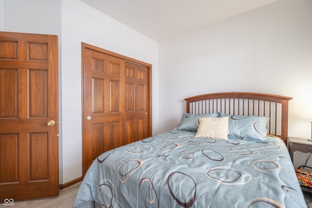 bedroom featuring a closet and wood finished floors