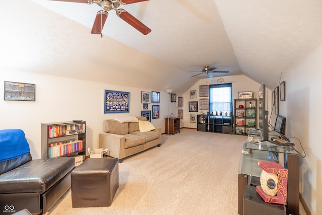 carpeted living room featuring vaulted ceiling, a textured ceiling, and a ceiling fan