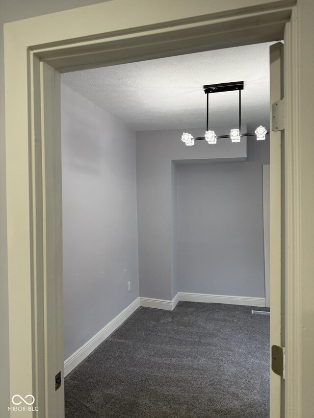 2312 Fletcher St, Anderson, IN 46016 - unfurnished room featuring dark colored carpet and baseboards