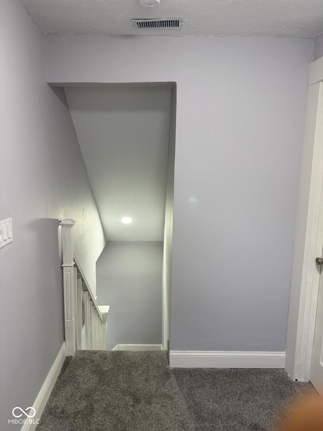 2312 Fletcher St, Anderson, IN 46016 - stairway featuring carpet floors and baseboards
