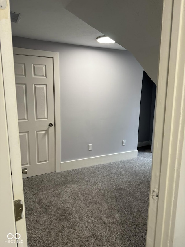 2312 Fletcher St, Anderson, IN 46016 - empty room featuring carpet flooring and baseboards