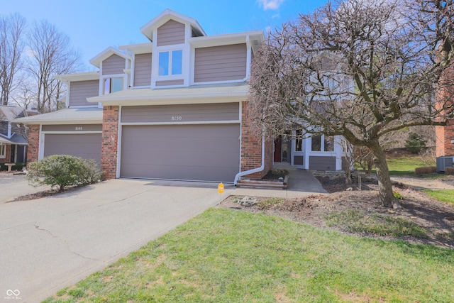 view of front of property featuring an attached garage, central AC unit, brick siding, and driveway