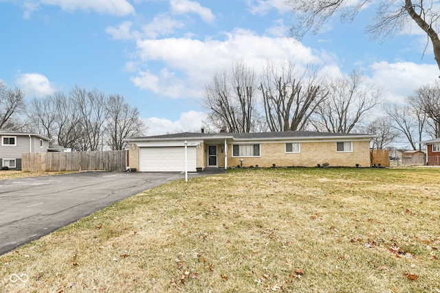 single story home with a garage and a front lawn