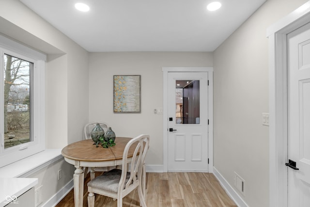 dining area with light wood-type flooring