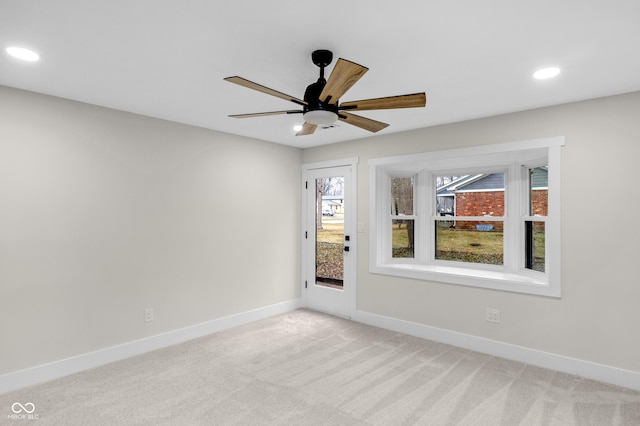 unfurnished room with light carpet and ceiling fan