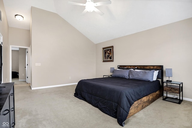 carpeted bedroom with ceiling fan and high vaulted ceiling