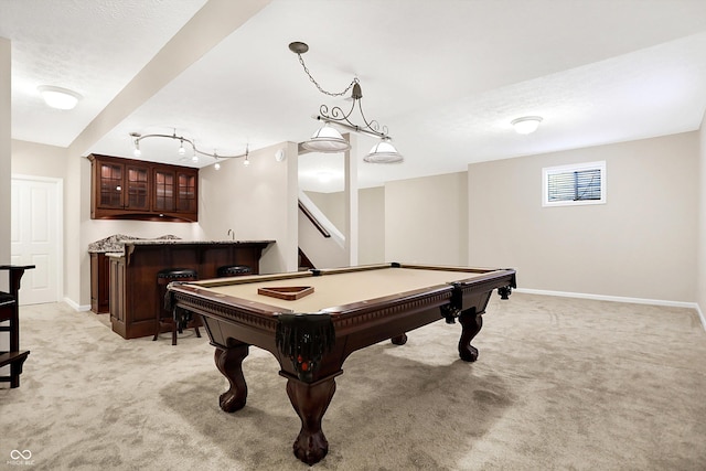 recreation room with light carpet, billiards, a textured ceiling, and bar area