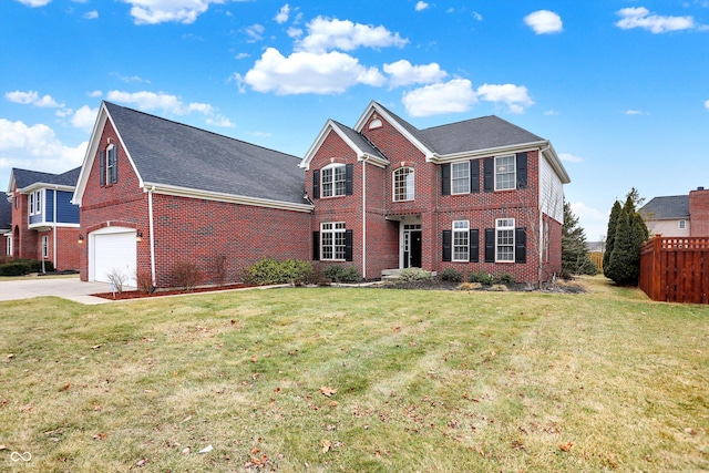 view of front of house featuring a garage and a front yard