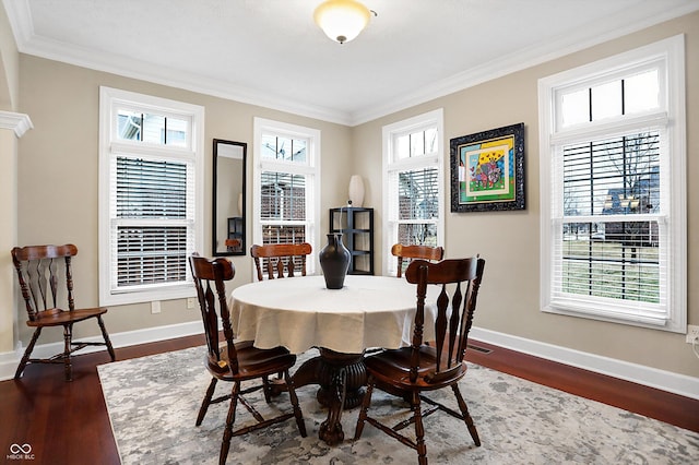 dining room featuring wood-type flooring and ornamental molding