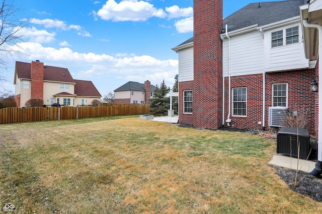 view of yard featuring cooling unit and a patio area