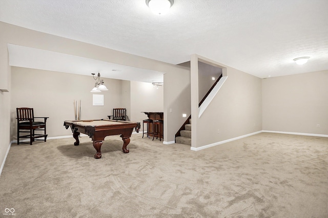 rec room with billiards, carpet floors, and a textured ceiling