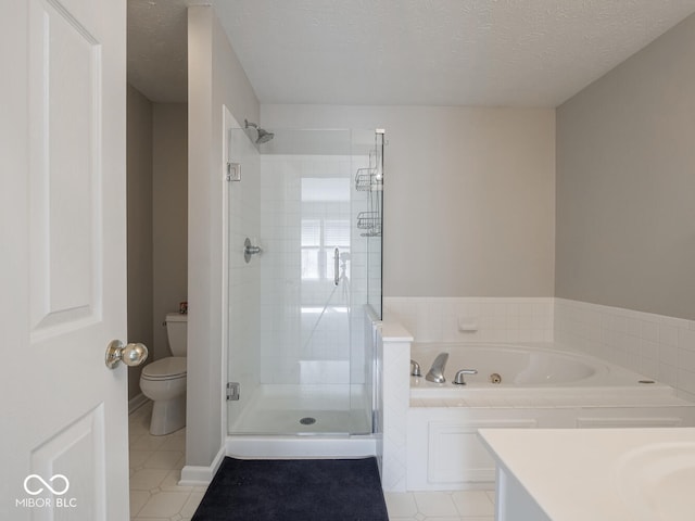 bathroom featuring a whirlpool tub, a textured ceiling, a shower stall, and toilet