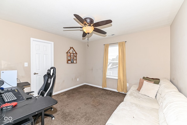 home office with baseboards, dark carpet, visible vents, and a ceiling fan