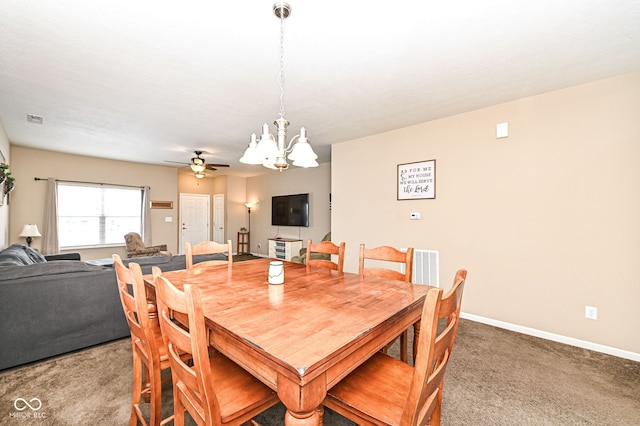 dining room featuring ceiling fan with notable chandelier, carpet flooring, visible vents, and baseboards