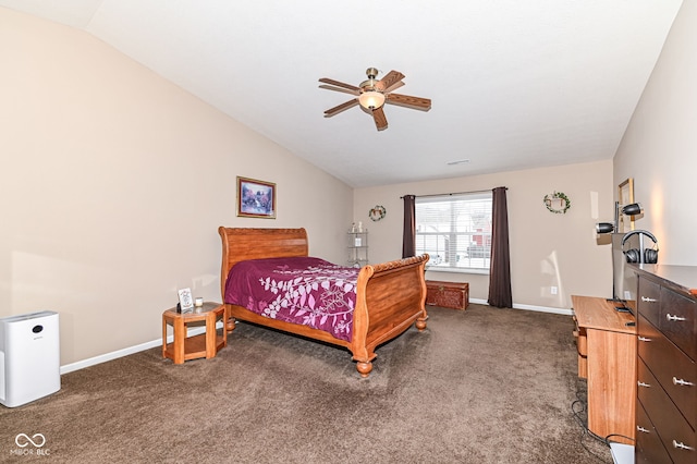 bedroom featuring lofted ceiling, ceiling fan, baseboards, and dark colored carpet