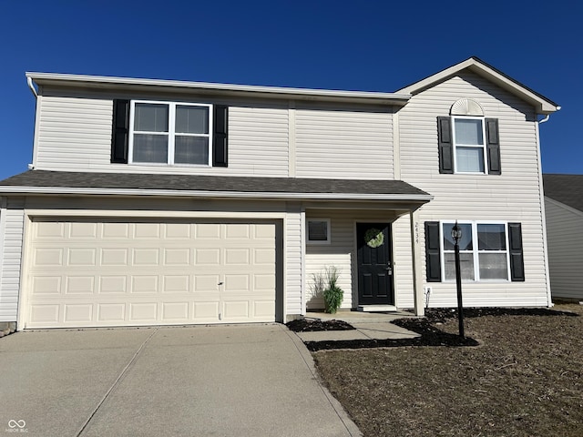 view of front of property with a garage