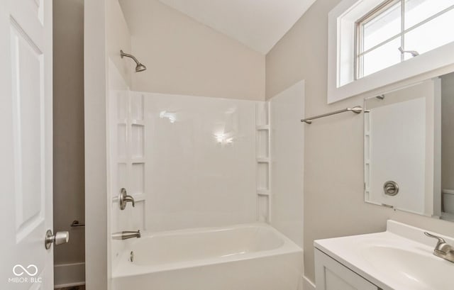 bathroom featuring vanity and bathing tub / shower combination