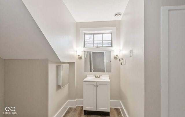 bathroom with wood-type flooring and vanity