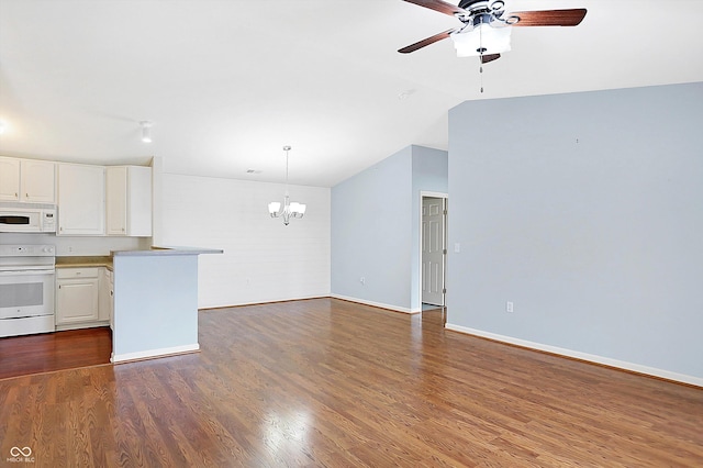 kitchen with vaulted ceiling, white appliances, white cabinetry, and dark wood finished floors