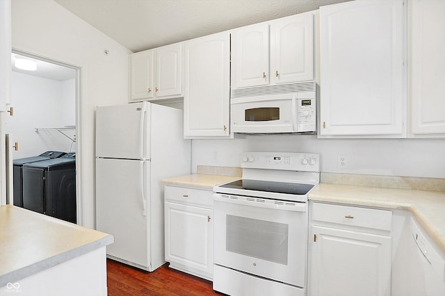 kitchen featuring white appliances, dark wood-type flooring, light countertops, washer and dryer, and white cabinetry