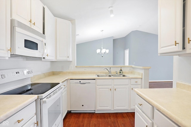 kitchen featuring white appliances, dark wood-style flooring, a sink, white cabinetry, and vaulted ceiling