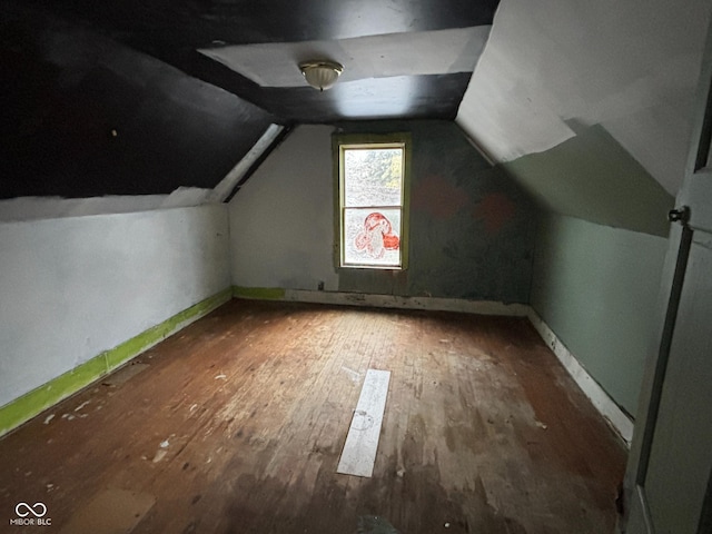 bonus room featuring lofted ceiling and wood-type flooring