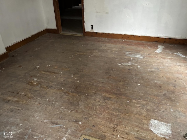 empty room featuring dark hardwood / wood-style flooring