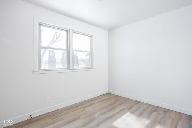 spare room with light wood-type flooring