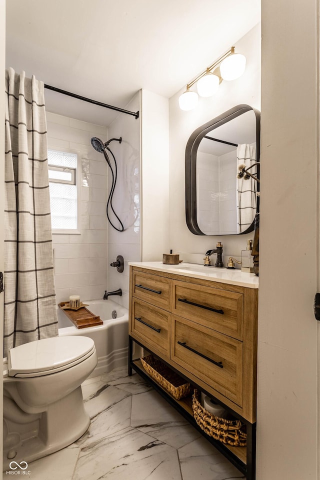 full bathroom with vanity, tiled shower / bath combo, and toilet