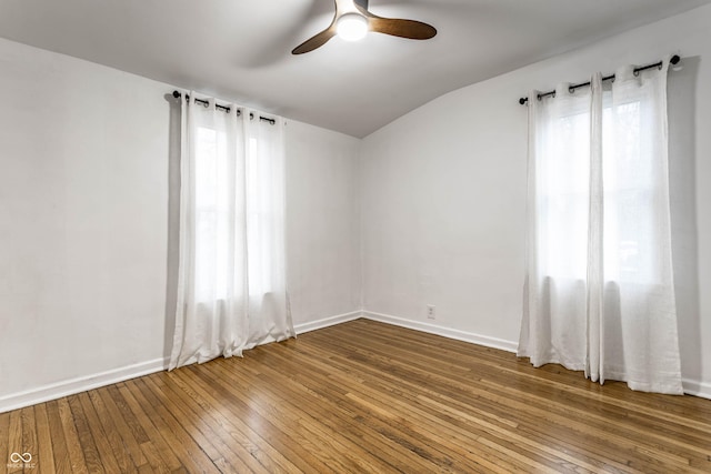 empty room with wood-type flooring and ceiling fan