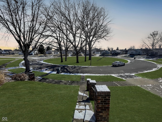 view of yard at dusk