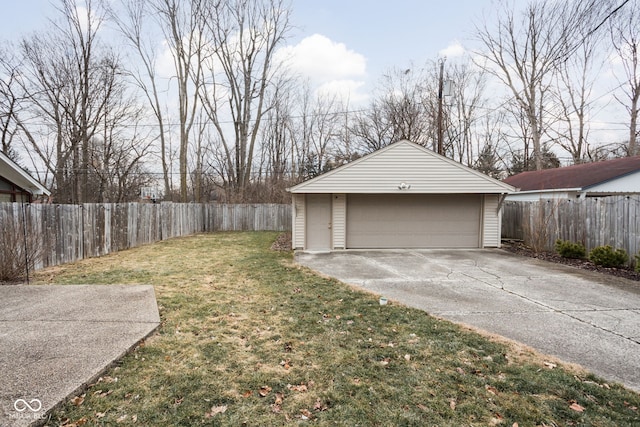 detached garage featuring fence