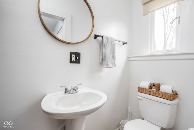 bathroom featuring toilet and a sink