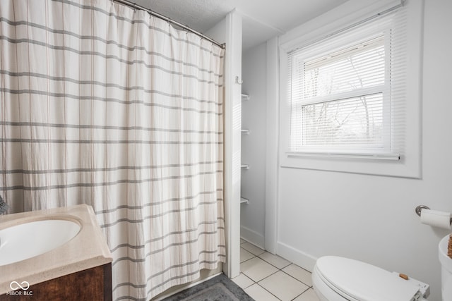 full bath with toilet, a shower with curtain, tile patterned floors, a textured ceiling, and vanity