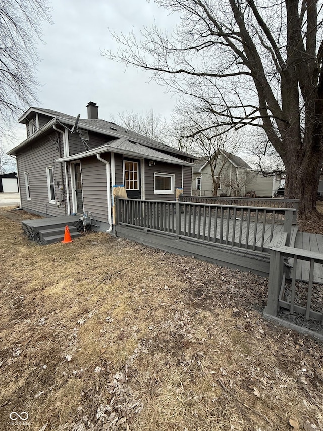 back of property featuring a deck