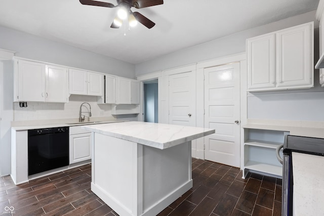 kitchen with dishwasher, sink, white cabinets, decorative backsplash, and stainless steel electric range