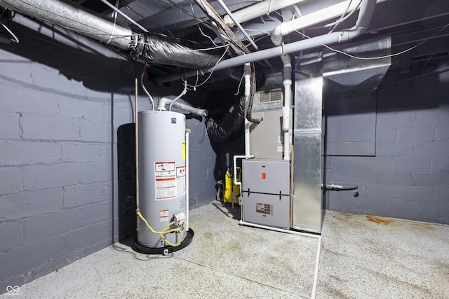 utility room featuring water heater and heating unit