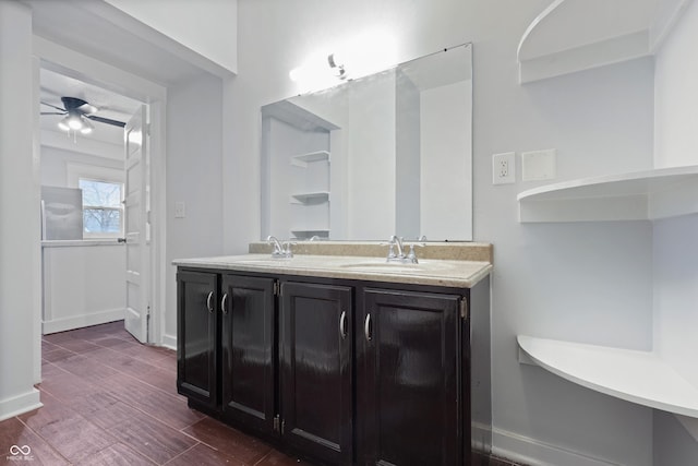 bathroom with hardwood / wood-style flooring, vanity, and ceiling fan