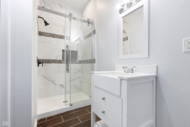 bathroom with vanity and an enclosed shower