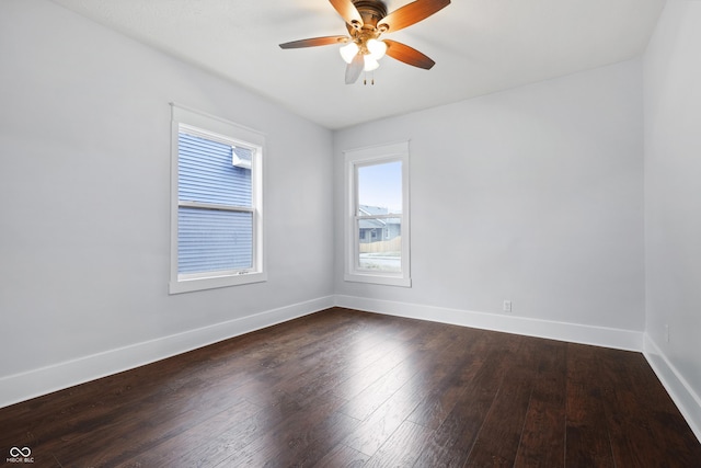 empty room featuring dark hardwood / wood-style floors and ceiling fan